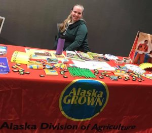 Lyssa Frohling staffs the Alaska Farm to School booth